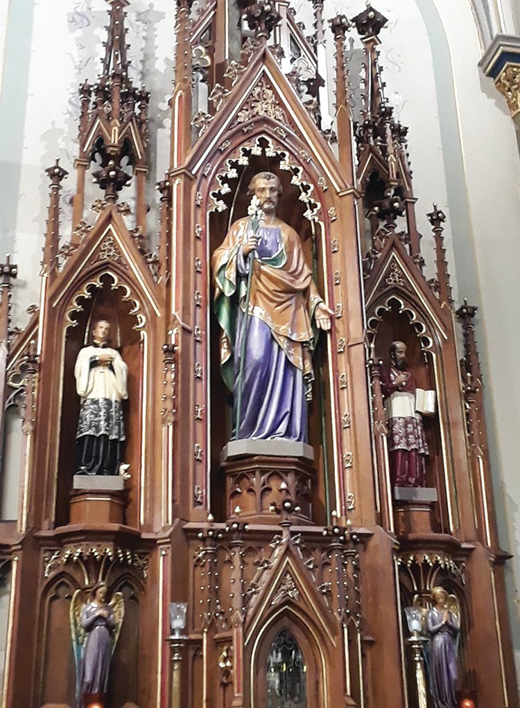 Statue of St. Joseph in an ornate reredos above a side altar in St. Peter Church in Jefferson City.